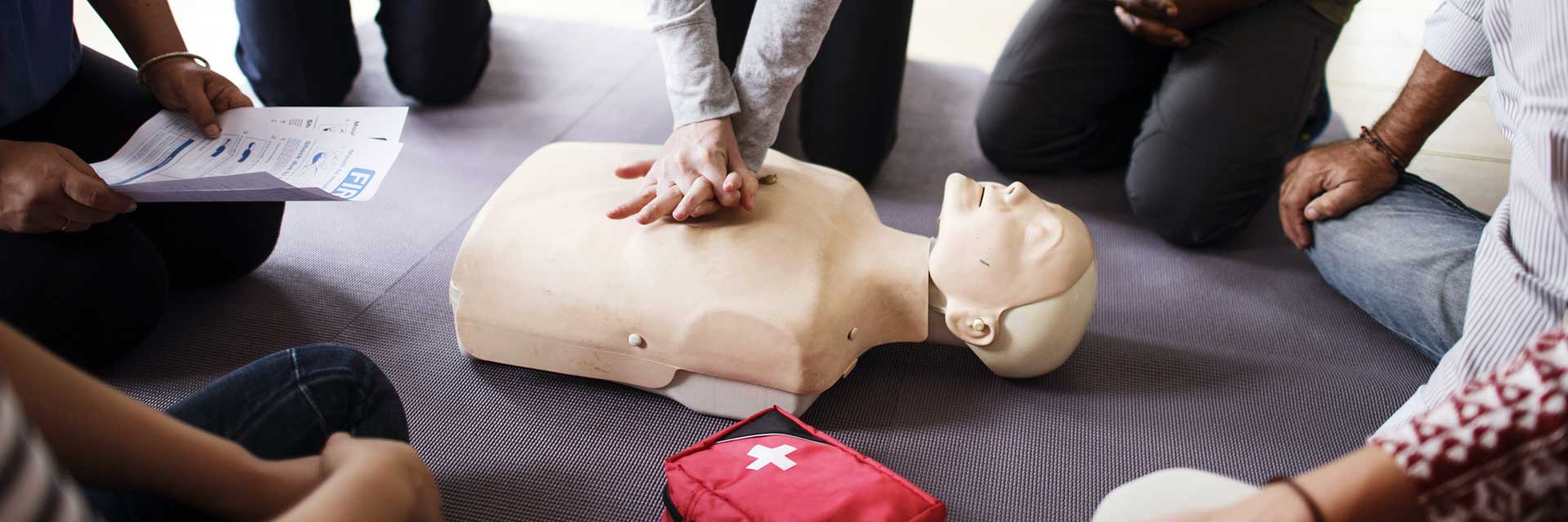 Group of people learning first aid.